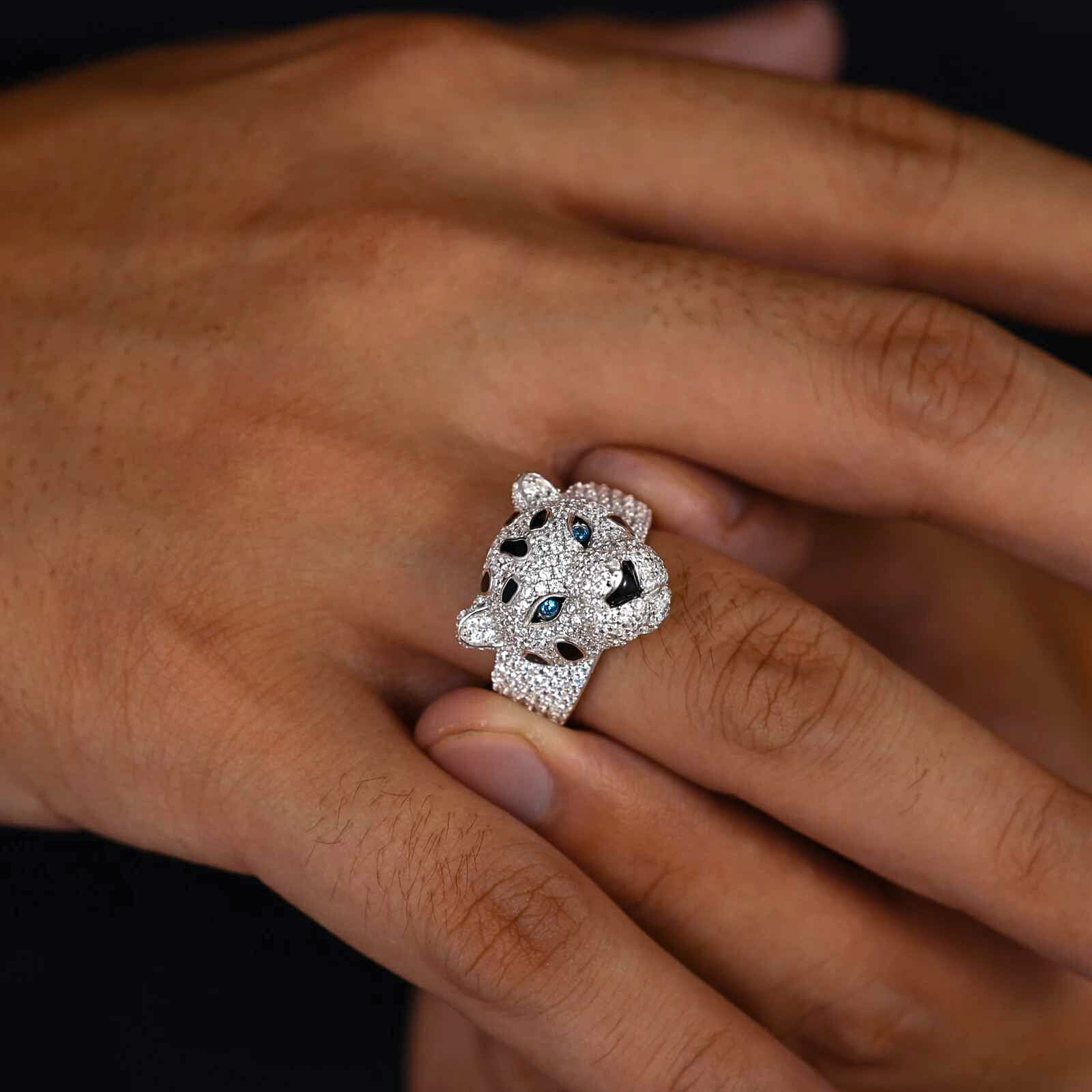 Silver panther ring with gemstones on a person&