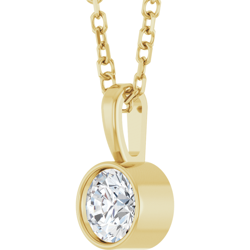 woman wearing 14k gold bezel diamond necklace minimalist solitaire natural diamond jewelry elegant style