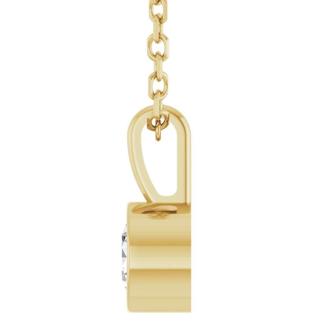 Chain and bezel setting detail of the Élise 14K yellow gold diamond necklace