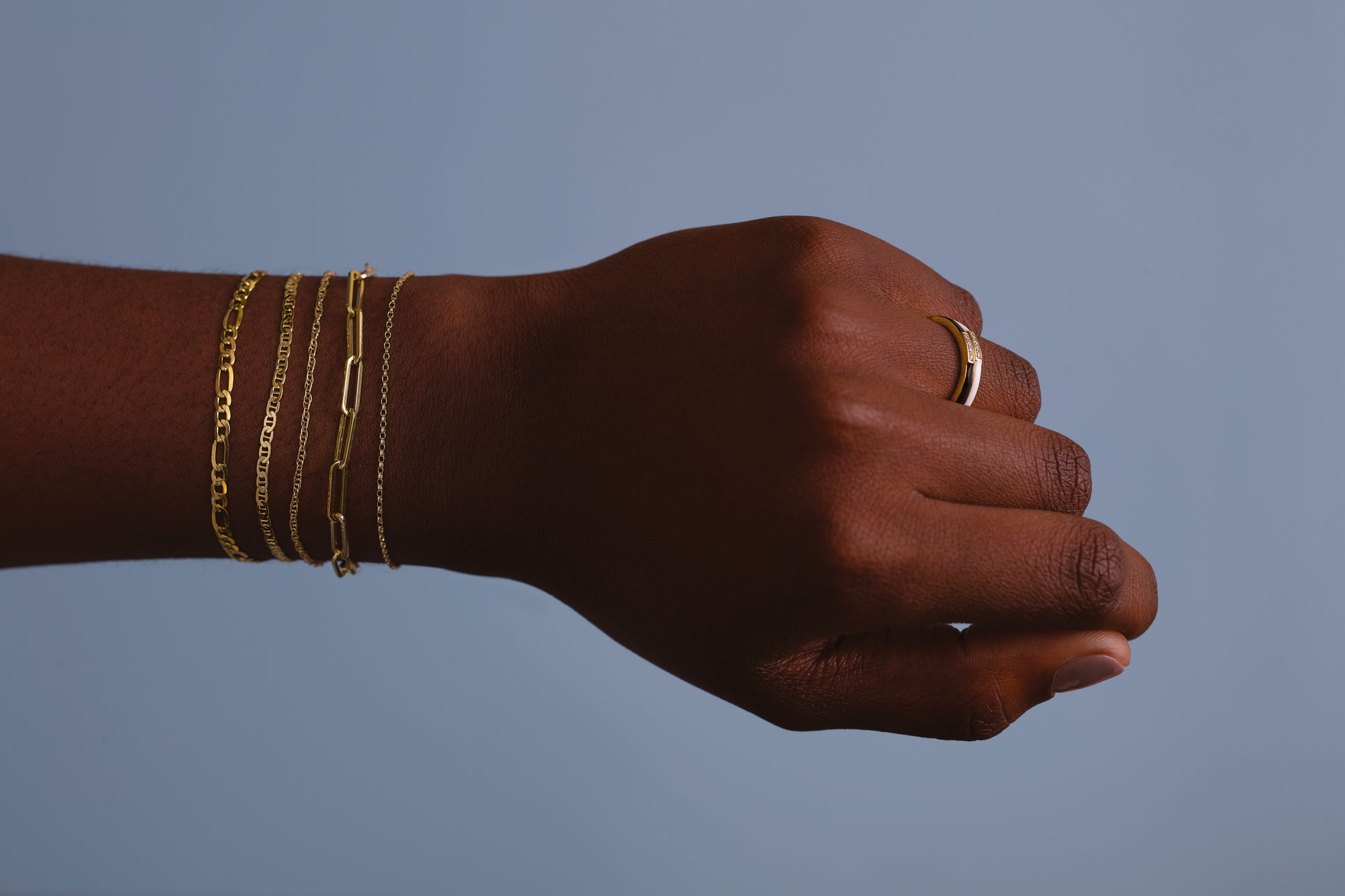 Expensive looking jewelry collection featuring elegant gold necklaces, timeless bracelets and luxury statement pieces by Guerilla Choice