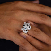 Silver panther ring with gemstones on a person&
