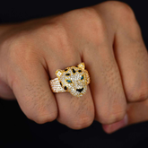 Gold panther head ring on a person&