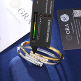 Diamond selector tool with three diamond-studded bracelets on a blue surface, with &