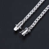 Silver bracelet with dragon clasp on a black background