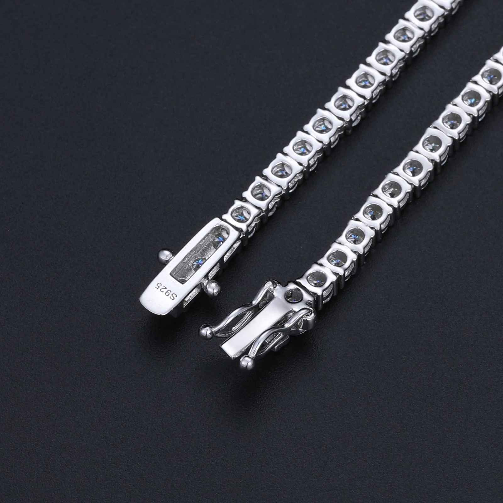 Silver bracelet with dragon clasp on a black background