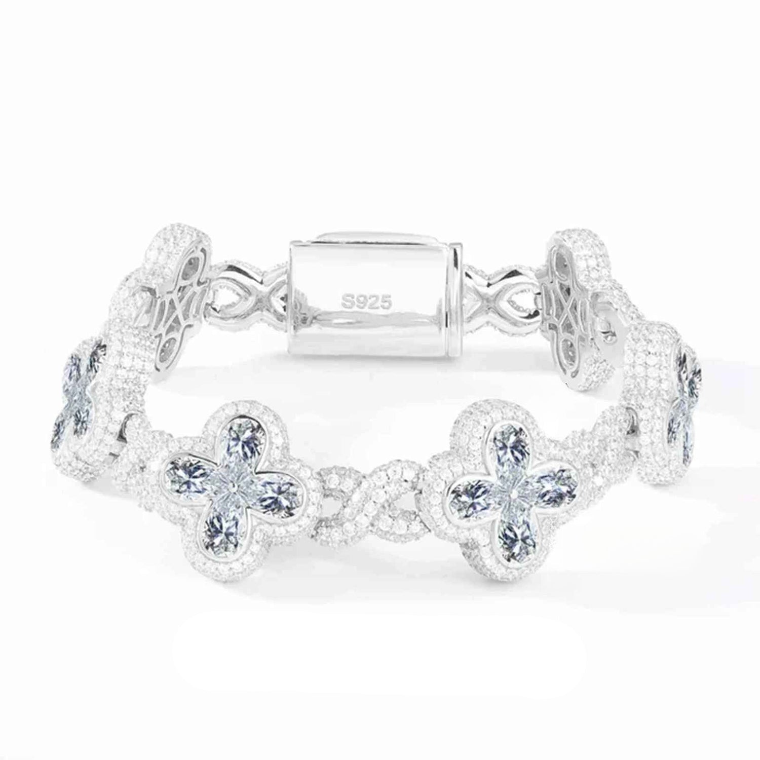 Silver bracelet with floral designs on a white background
