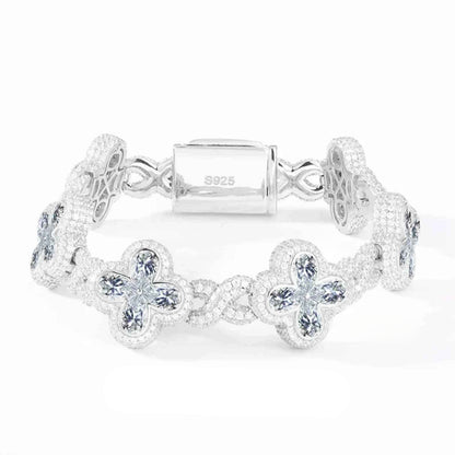 Silver bracelet with floral designs on a white background