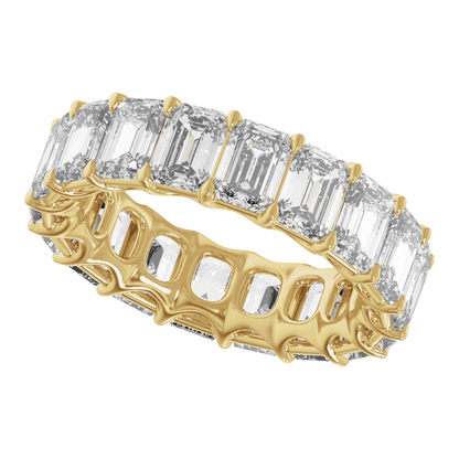 Angled view of a 9 1/3 CTW emerald-cut diamond eternity band in polished 14K yellow gold