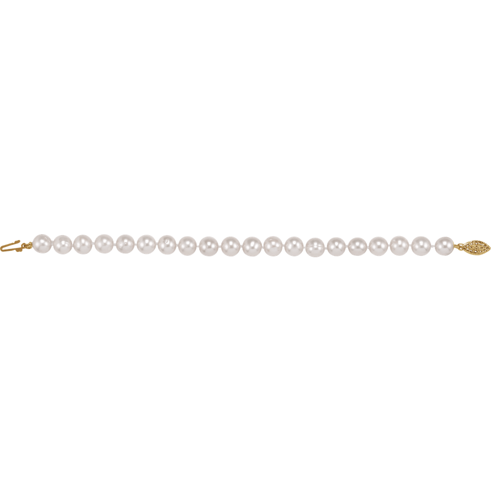 Perle d’Or Blanche 14K gold-filled freshwater pearl bracelet with white cultured pearls
Luxury freshwater pearl bracelet with polished 14K yellow gold-filled clasp
Elegant white pearl bracelet by Guerilla Choice jewelry
