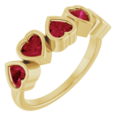 Angled view of Cinq Cœurs solid 14K yellow gold ring set with five heart-shaped natural Mozambique garnets