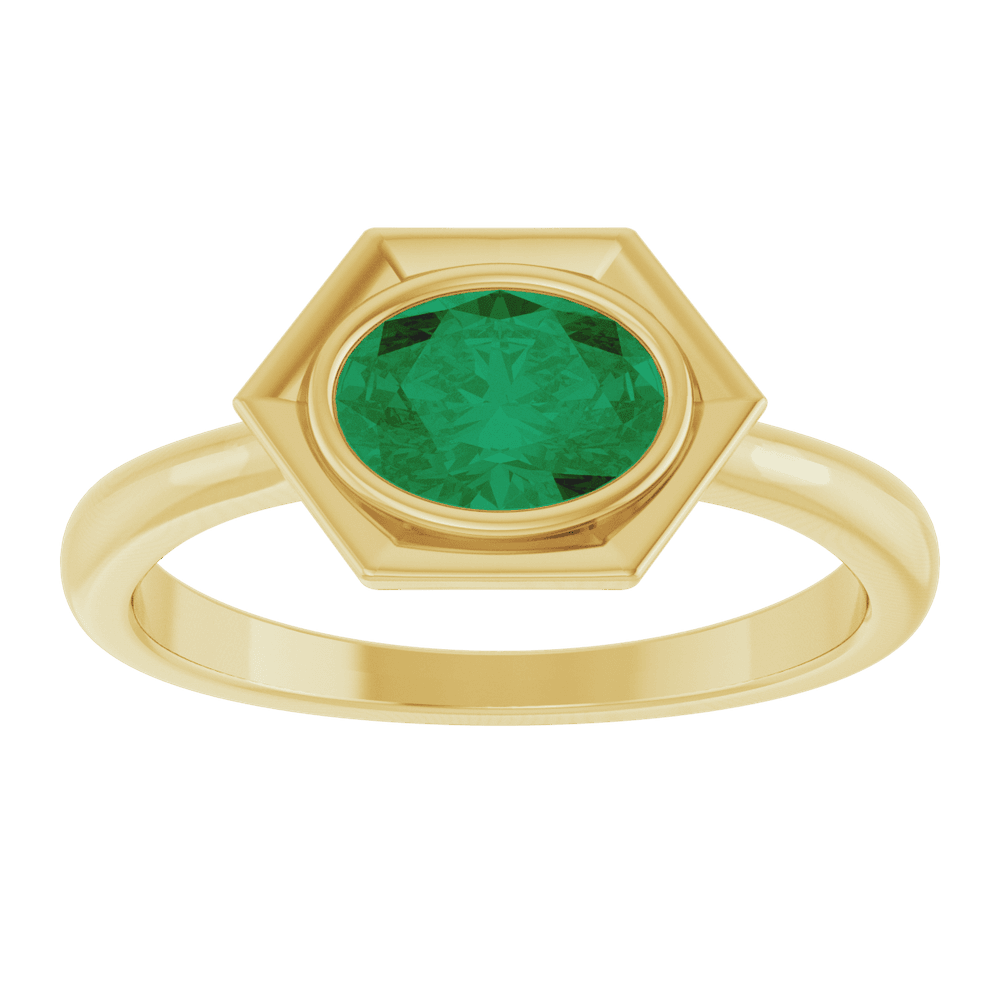 emerald ring close up green stone bezel