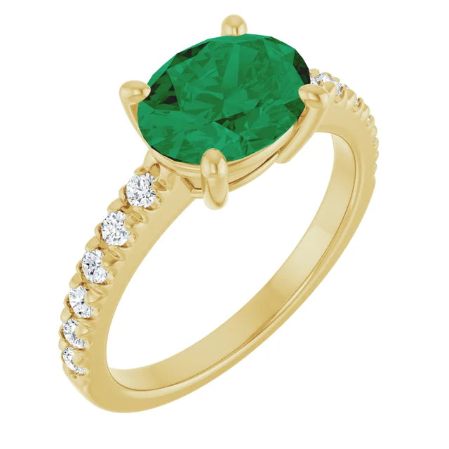 Rêve d’Émeraude 14K yellow gold ring with a 9 × 7 mm oval emerald and natural diamond accents