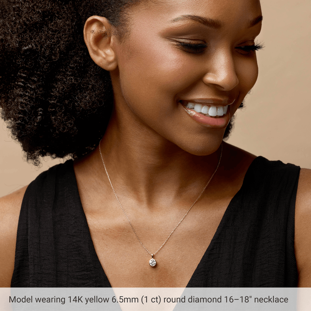 close up 0.25 ct natural round diamond bezel setting 14k yellow gold necklace detail