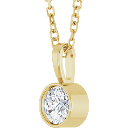 woman wearing 14k gold bezel diamond necklace minimalist solitaire natural diamond jewelry elegant style