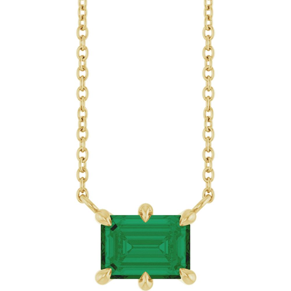 Clarté d’Émeraude 14K yellow gold necklace with a 7 × 5 mm lab-grown emerald on an 18-inch cable chain