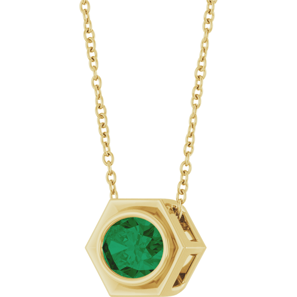 emerald necklace close up green stone bezel setting