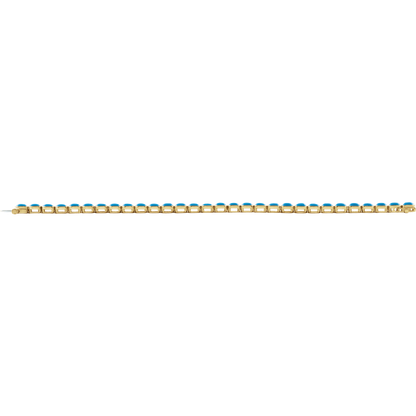 woman wearing turquoise gold bracelet vibrant blue gemstone luxury jewelry