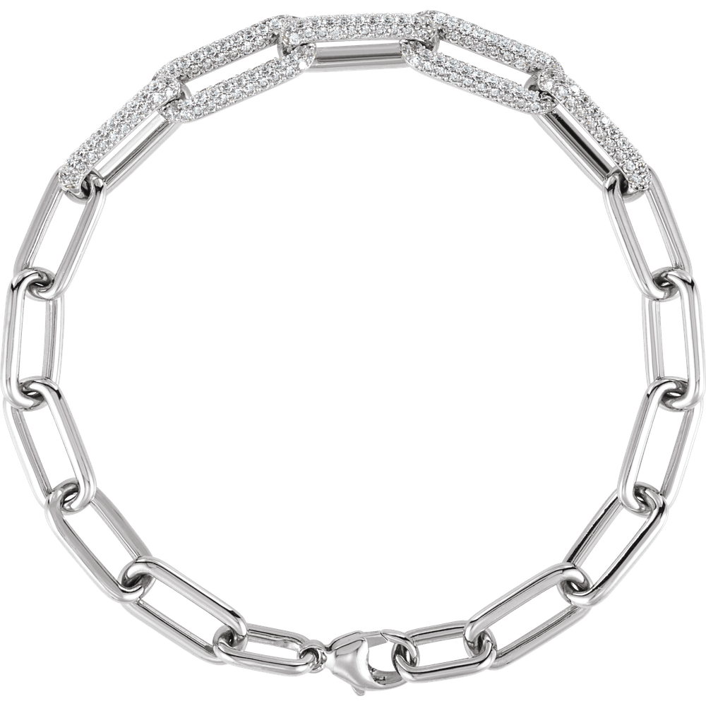 Close-up of F+ VS lab-grown round diamonds set across the links of a 14K gold paperclip bracelet