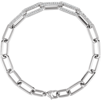Close-up of F+ VS lab-grown round diamonds set across the links of a 14K gold paperclip bracelet