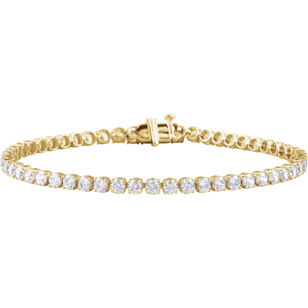A yellow gold tennis bracelet featuring a row of round-cut clear gemstones, set against a plain white background.