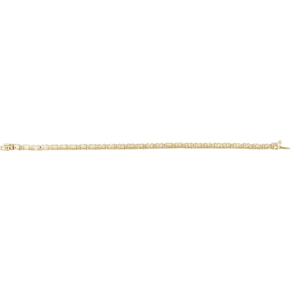A delicate yellow gold tennis bracelet shown horizontally against a solid white background.
