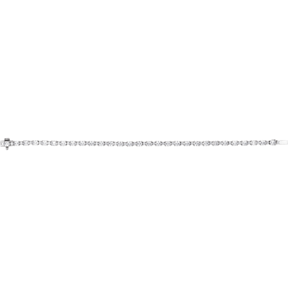 Close-up of G-H oval lab-grown diamonds set in a solid 14K gold bracelet
