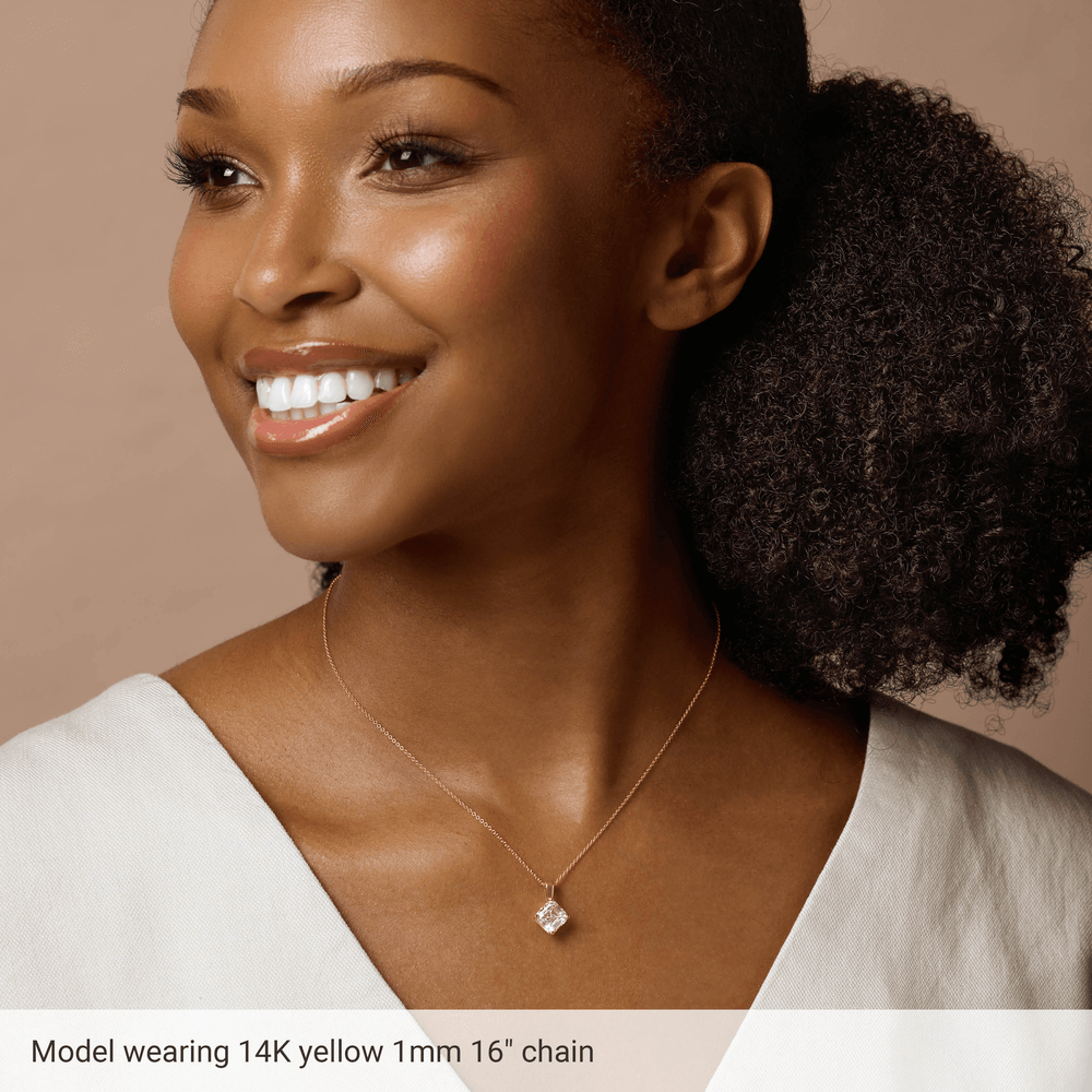 Thin 14K gold-filled cable chain styled with a lightweight pendant
