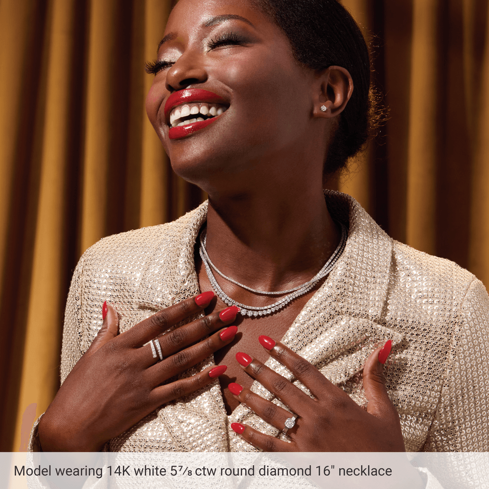 Model wearing Guerilla Choice 14K white gold diamond tennis necklace with layered diamond jewelry