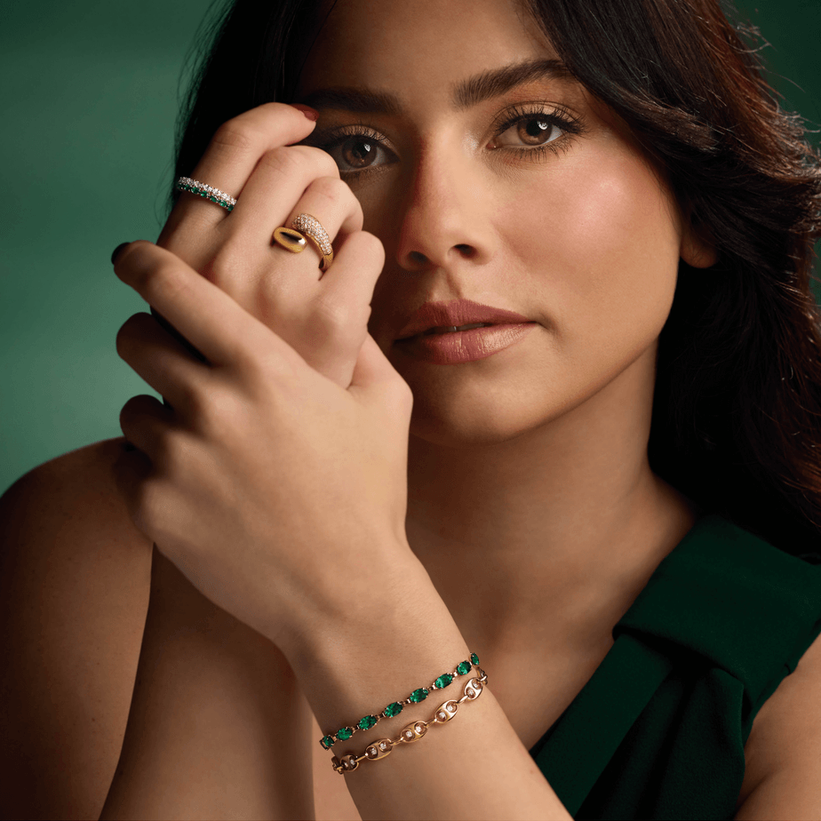 Model wearing Guerilla Choice 14K yellow gold diamond statement ring in luxury editorial styling
