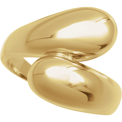 Close-up detail of Guerilla Choice sculptural bypass ring in polished yellow gold