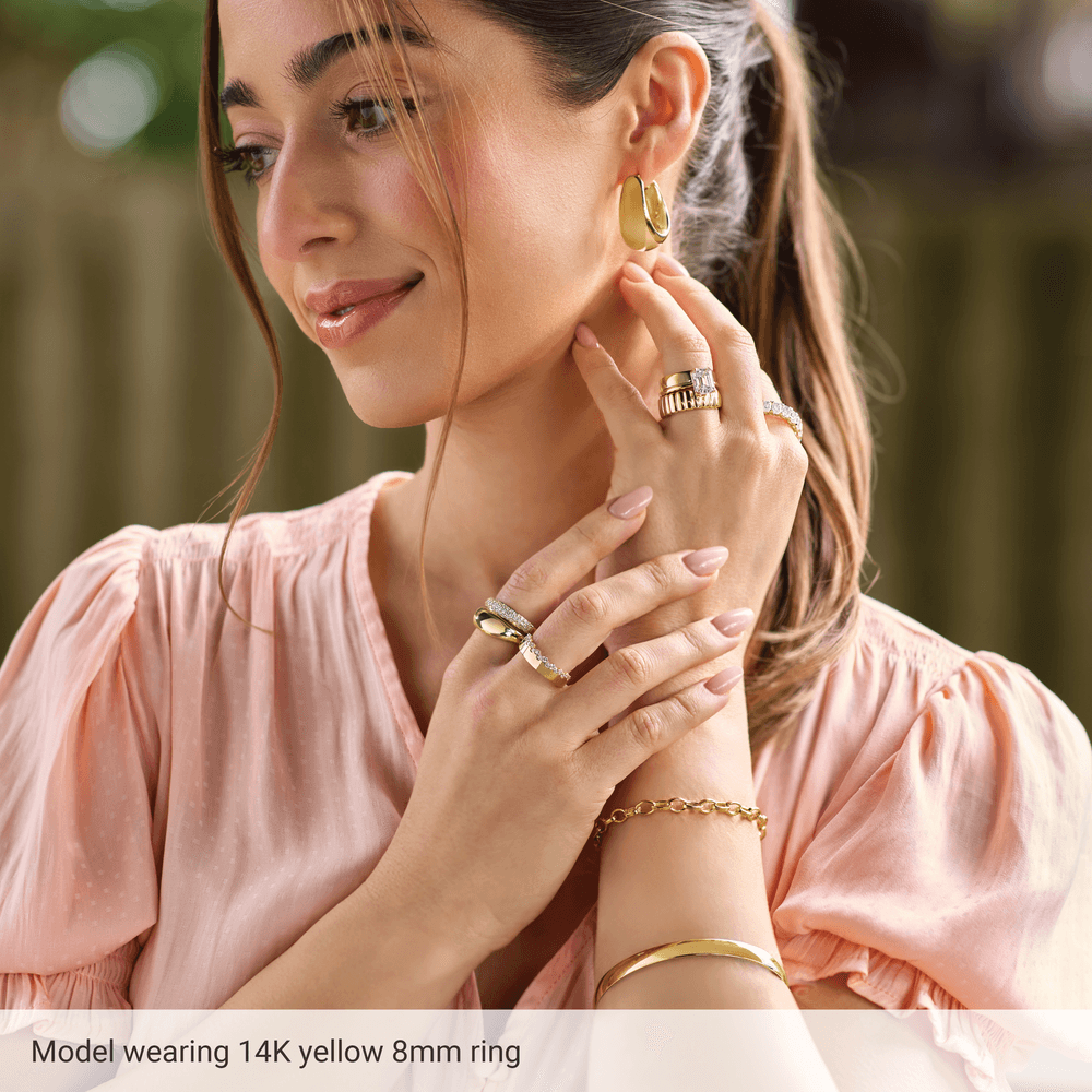 Angled view of the Riviera polished 14K gold dome ring